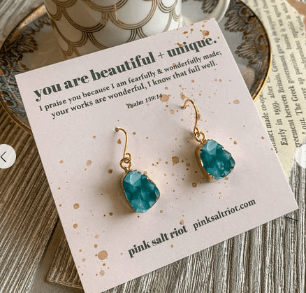A pair of blue dangle earrings