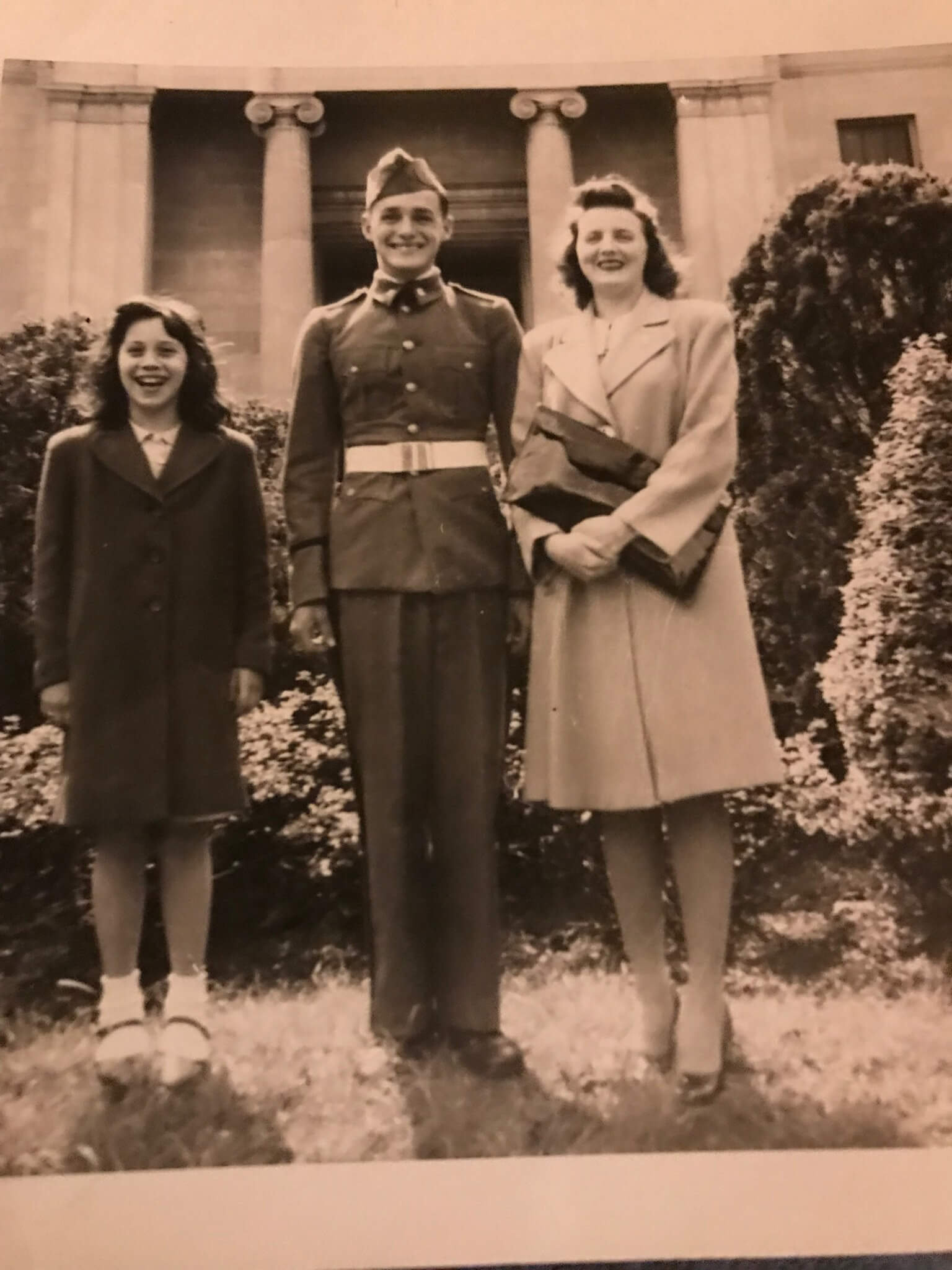 US army soldier in the 1940's standing in between his sisters